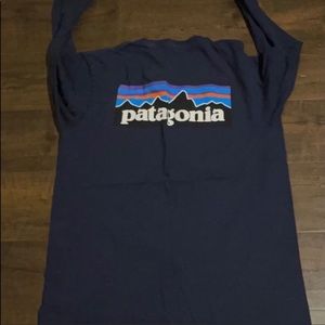 2 men Patagonia long sleeve shirts